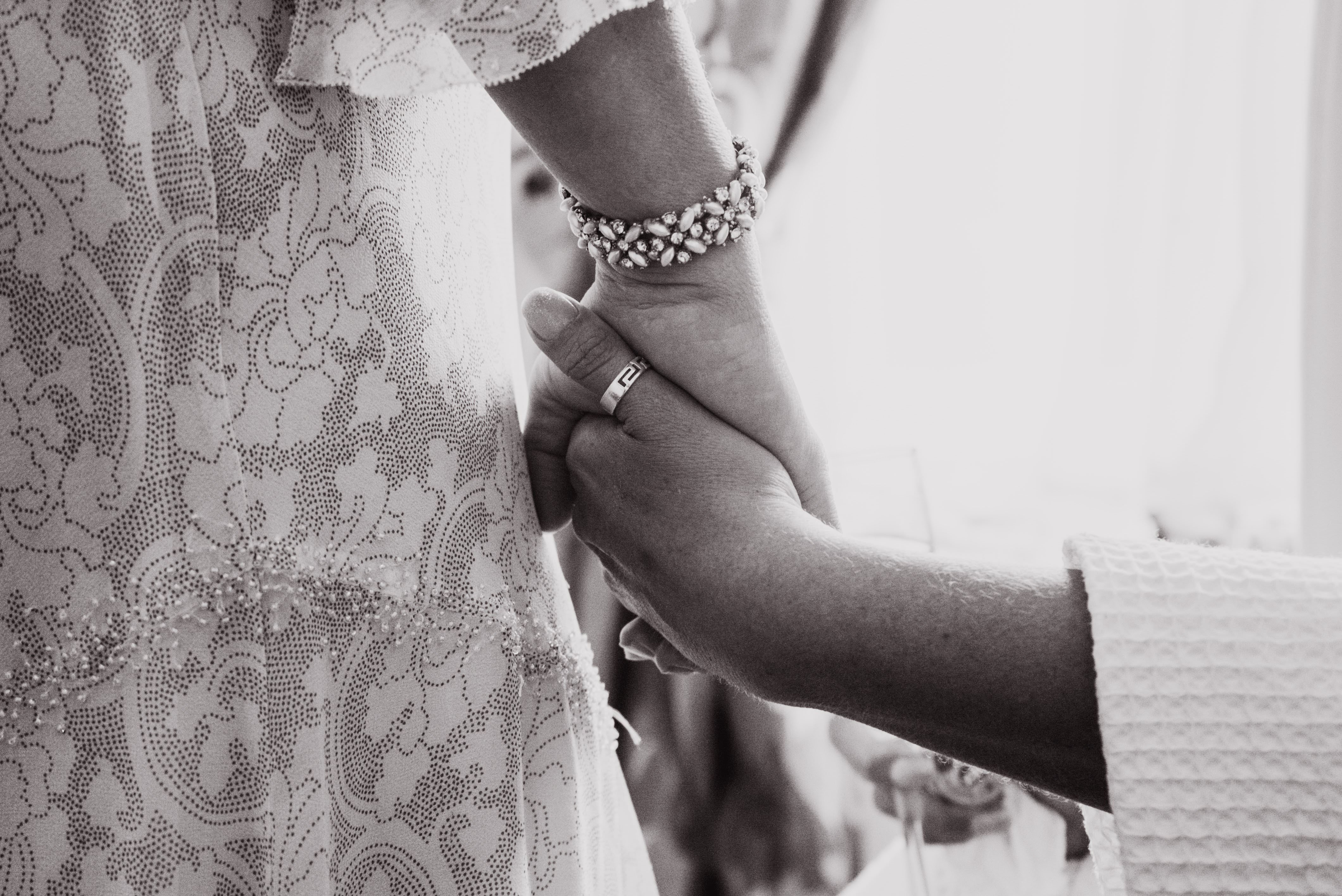 Mum Holding Hands With Bride